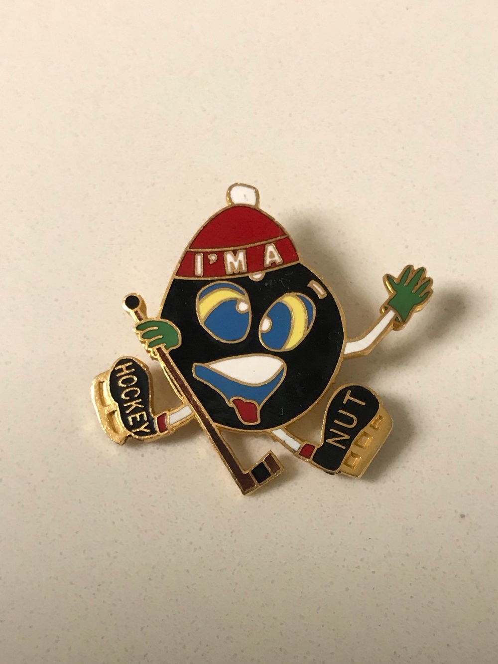 Enamel Hockey Nut Character Pin - Black, Red, Blue, Green, Gold